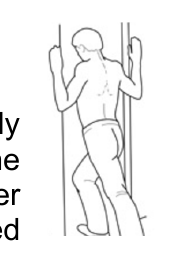 External rotation in a doorway, leaning forward with hands on the frame