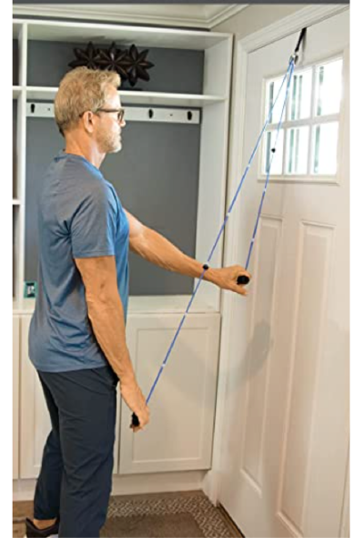 Pulley exercise using a shoulder pulley secured over a door